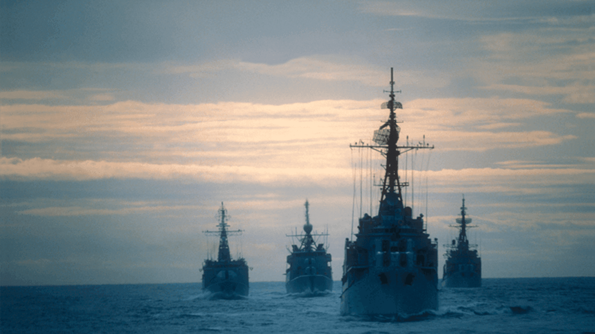 four boats on the ocean