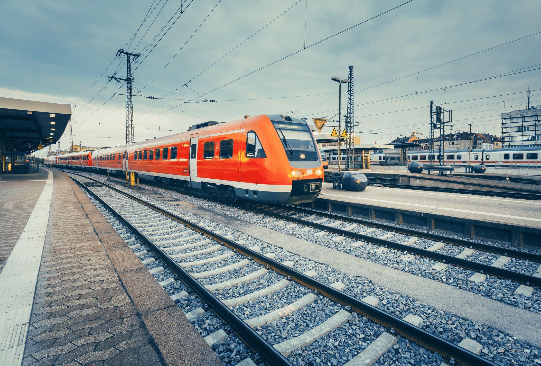 red train standing at a train station