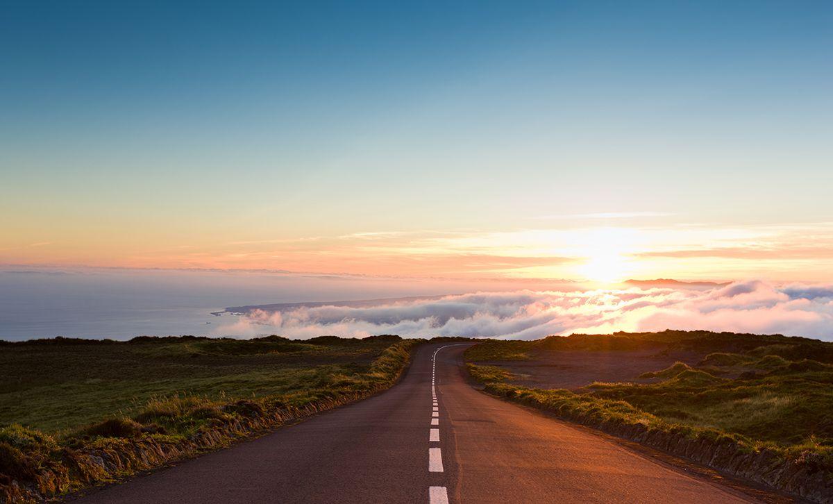 empty street with sunset on the horizon