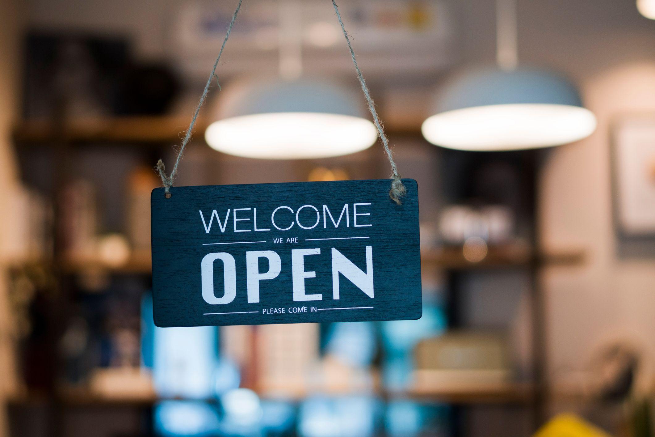 Welcome/Open sign in a shop