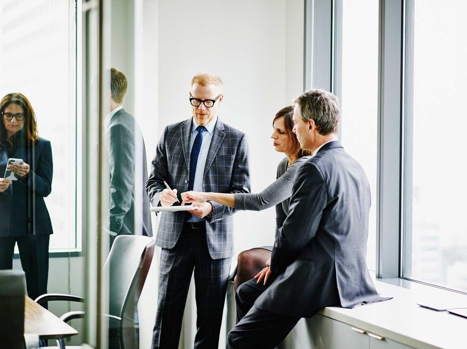 Three people in a conference