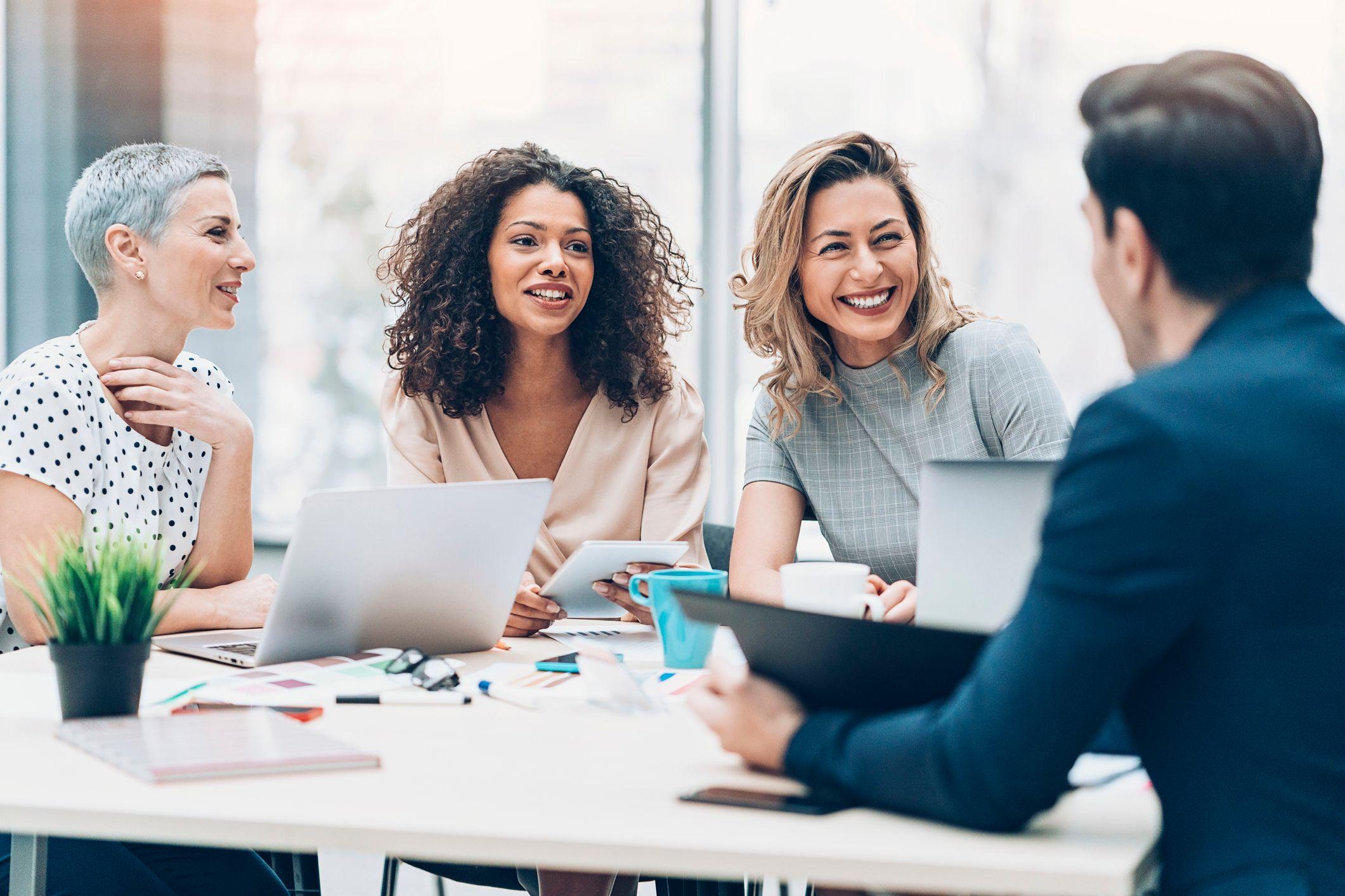 Four people collaborating on work